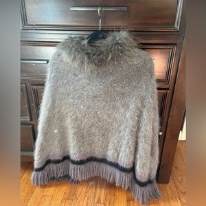 Poncho with raccoon fur collar